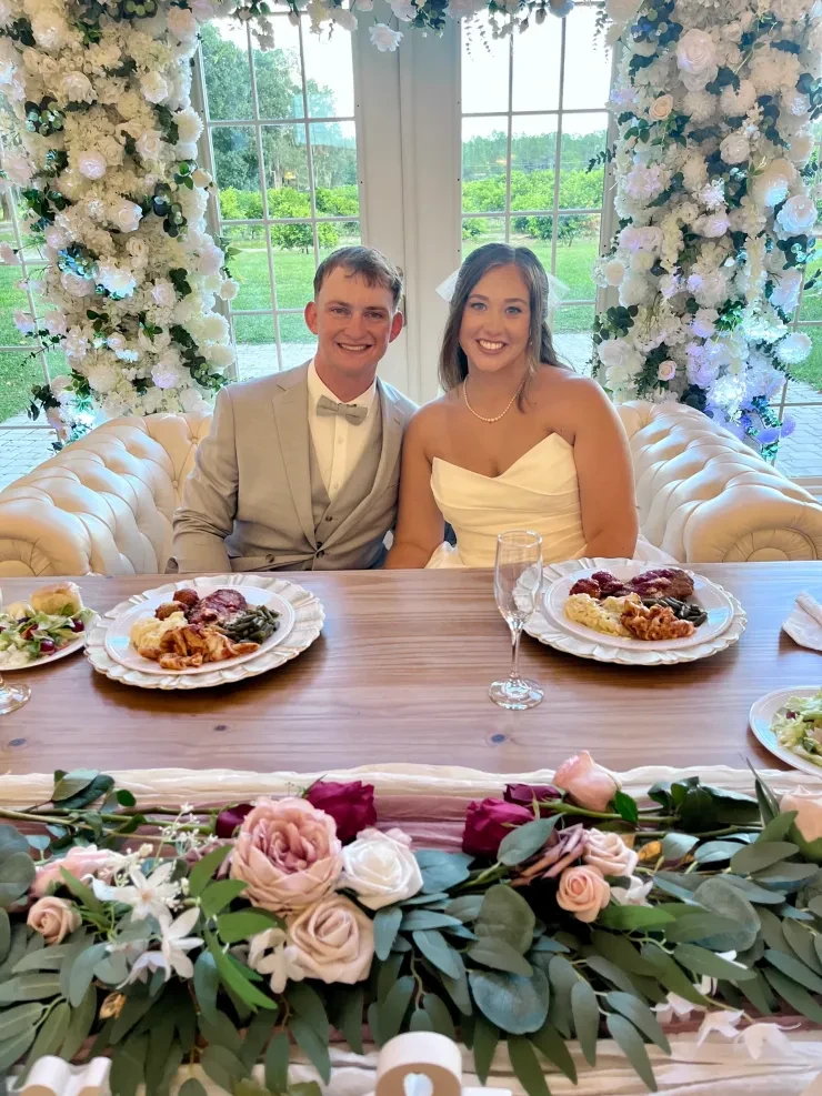 Couple at elegant wedding reception dinner