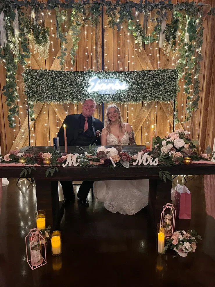 Mr and Mrs barn wedding with neon sign and string lights