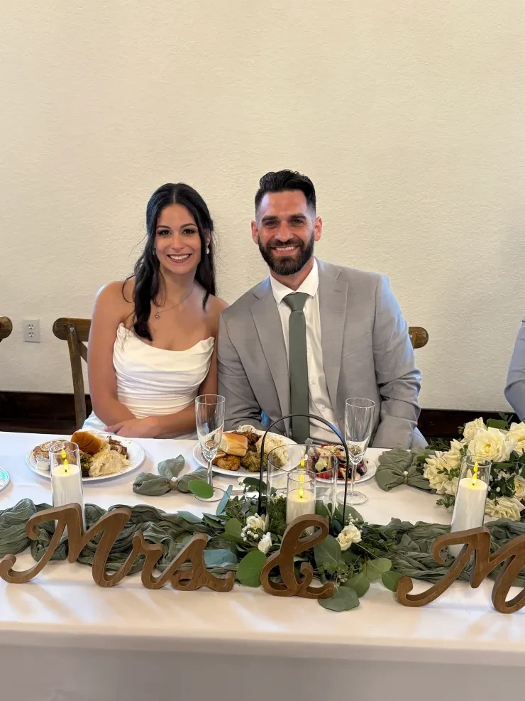 Mrs and Mr sweetheart table with sage green florals
