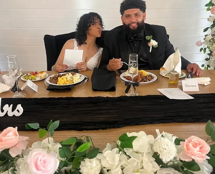 Couple at wedding reception dinner table